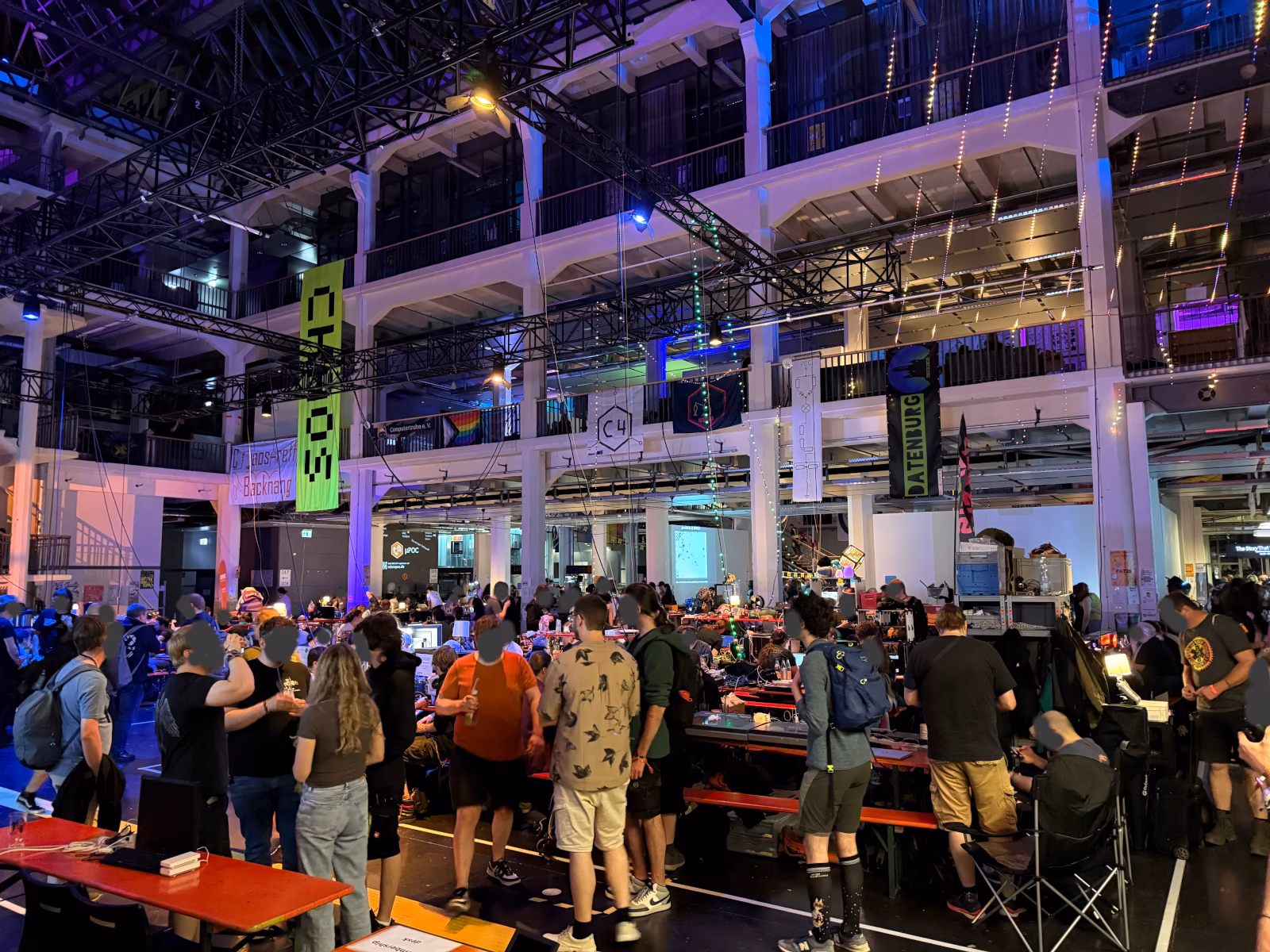 Photo of GPN24 attendees gathered in a large hall