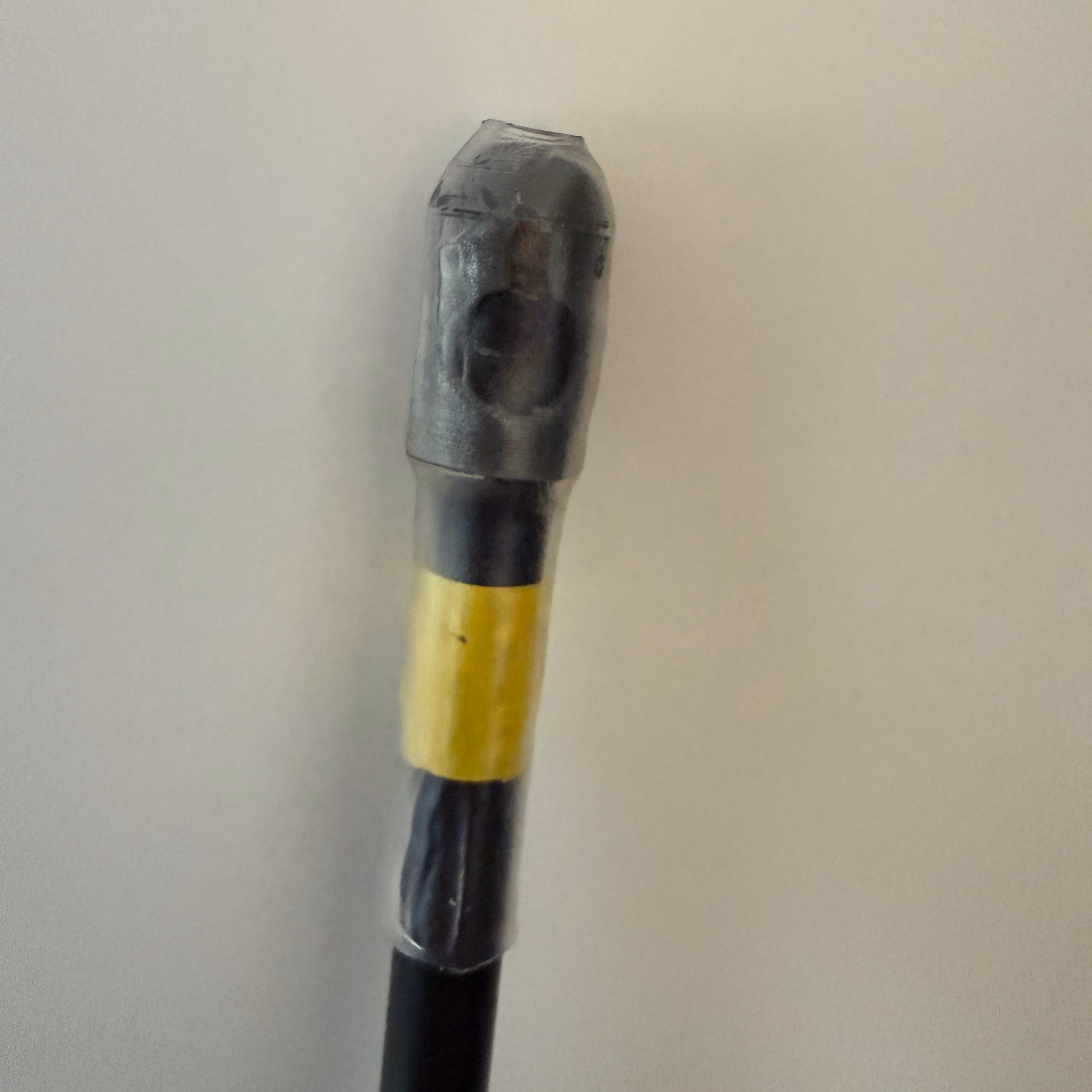 A printed bungee end cap fitted to a tent pole